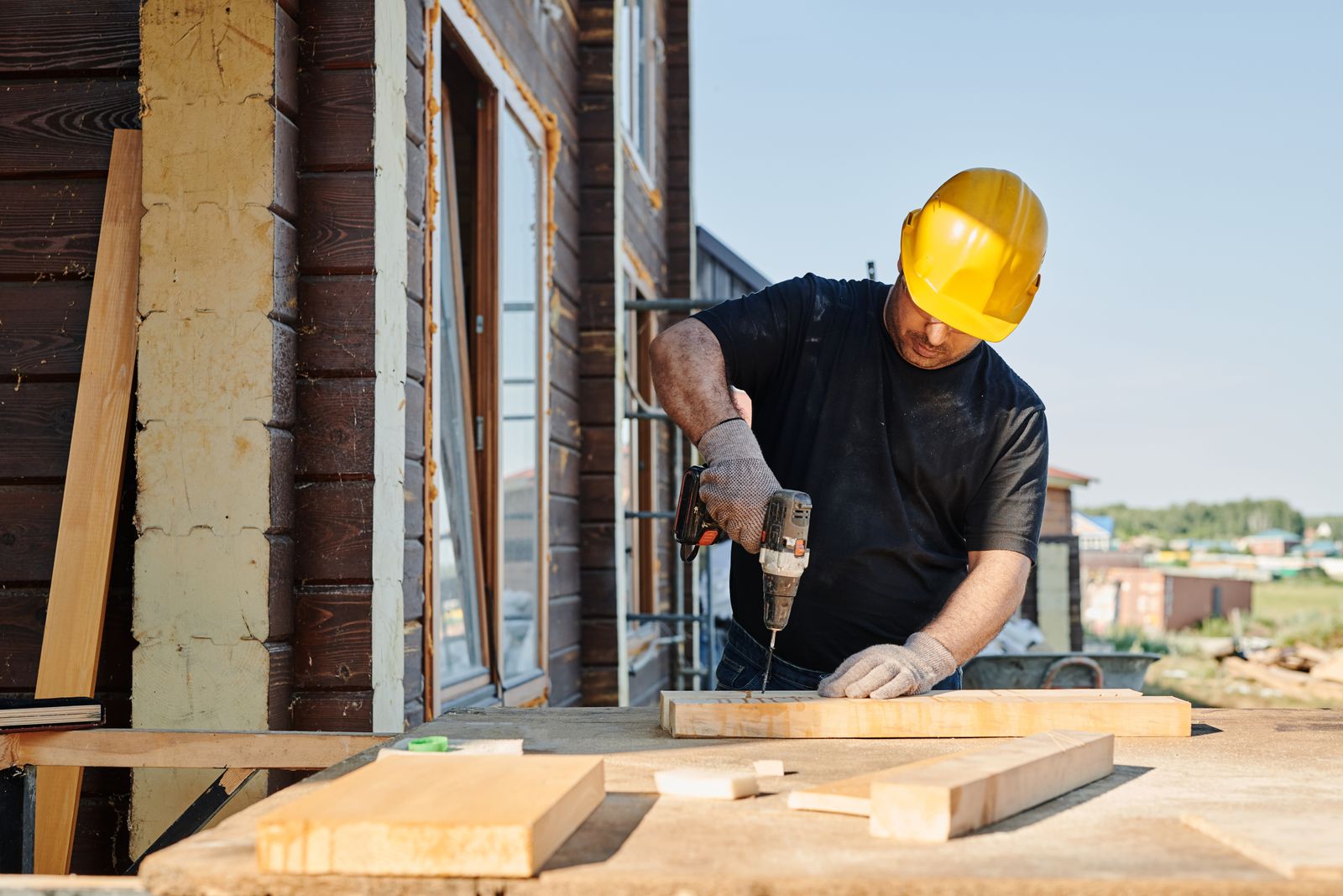 A carpenter working inside an occupied house